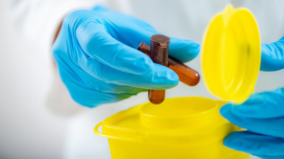 medicine going into a hazardous waste bin in a care home