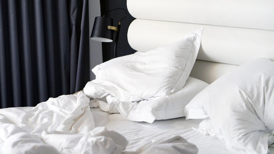 dirty bedding being thrown away