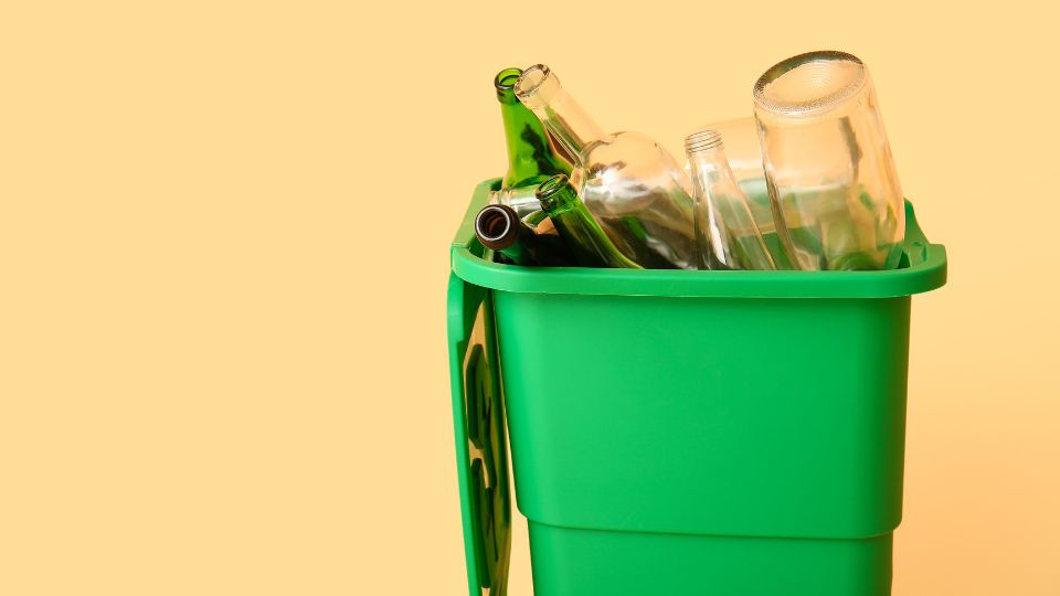 Glass recycling in a green bin.