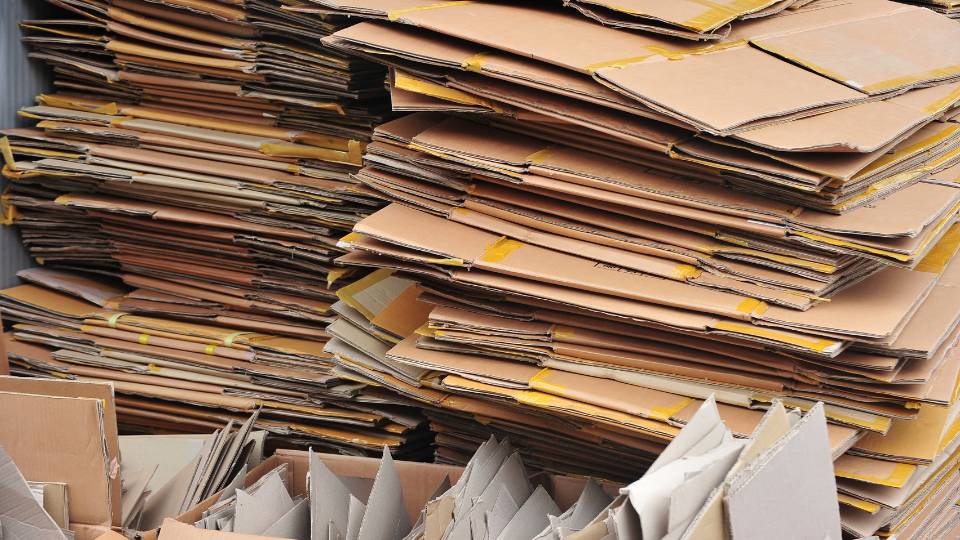 a stack of cardboard waste being sold by a business