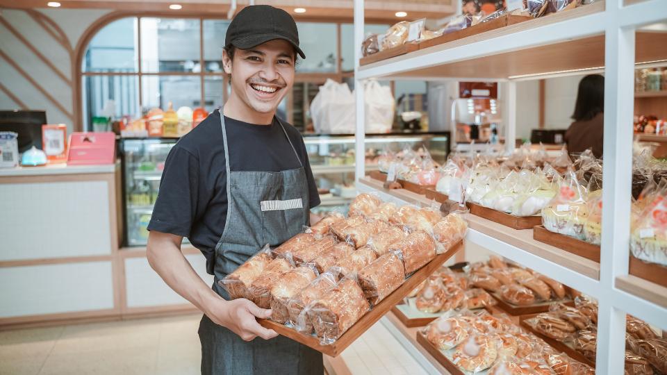 a bakery employee getting products ready to donate