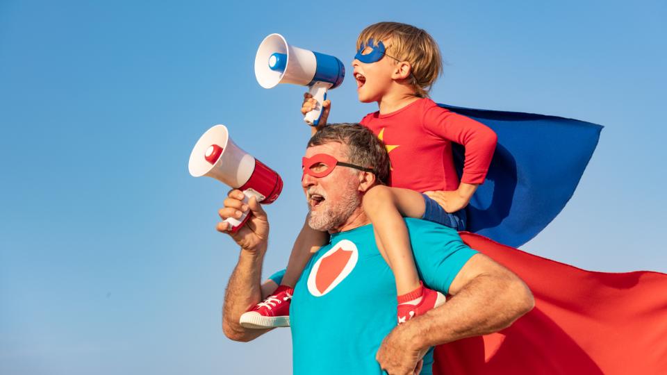 A son and father dressed up as superheroes