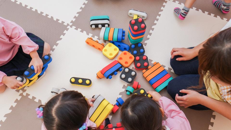 Nursery children playing with toys