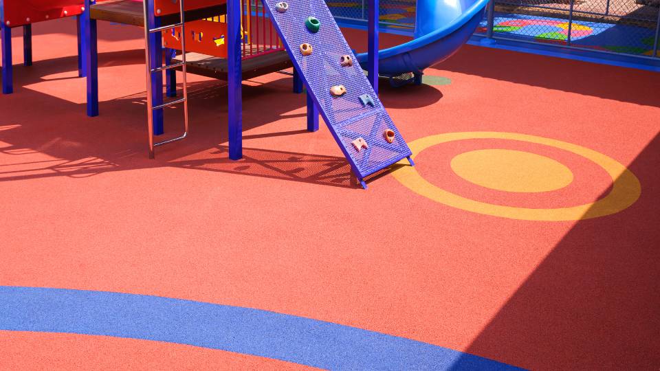 a playground with flooring made from recycled tyres