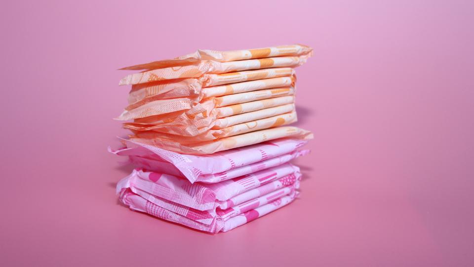 sanitary pads in front of a pink background