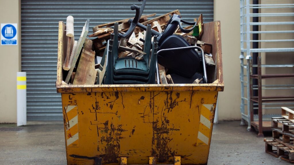 furniture in yellow skip