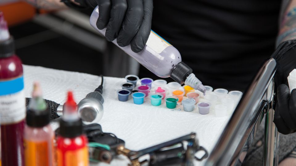 Multi-colour ink being separated in a tattoo store.