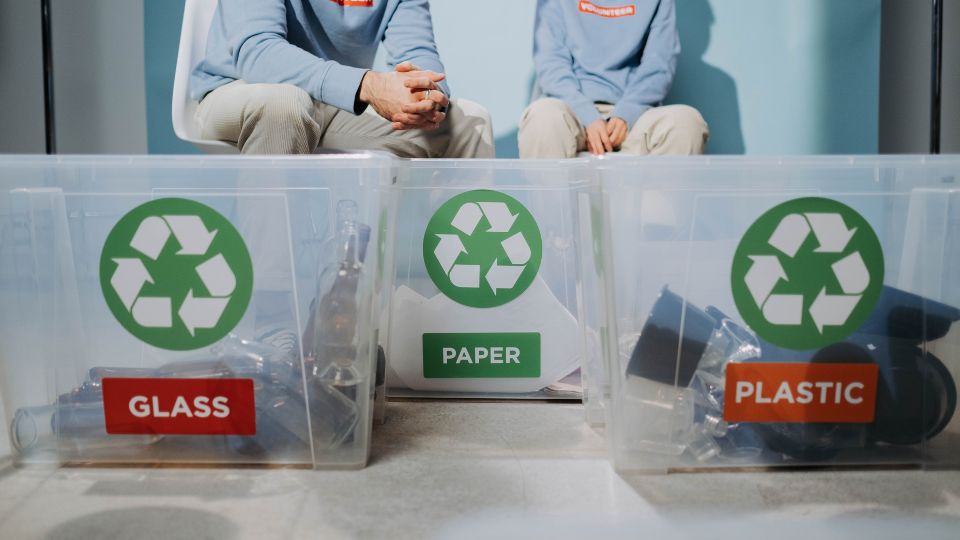 Recyclable materials in tubs in categorised containers.
