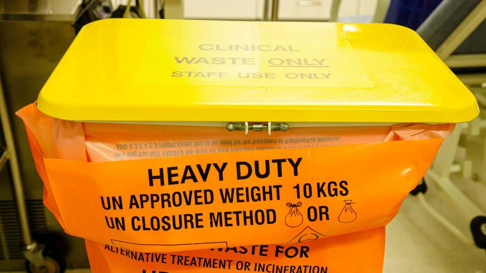 Orange clinical waste bin