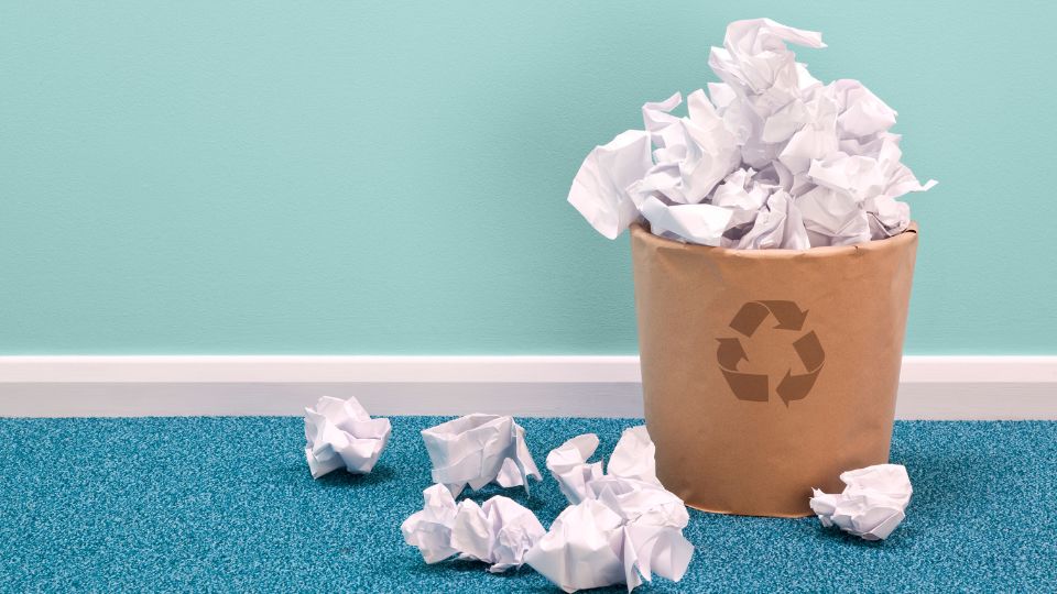 A bin filled with paper.