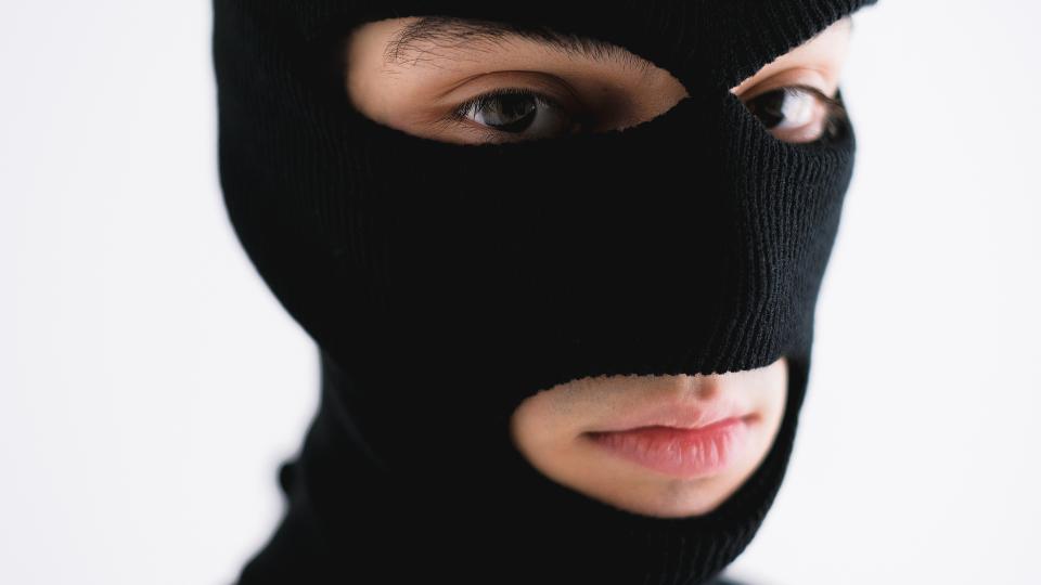Man wearing black ski mask