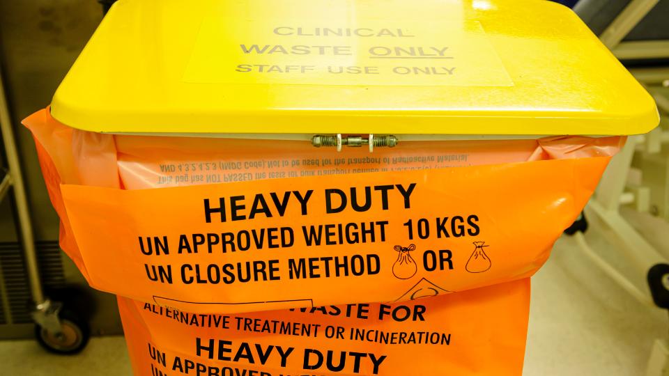 Yellow clinical waste bin