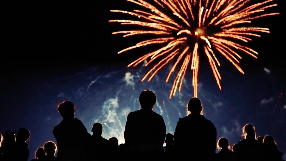 Fireworks with crowd watching