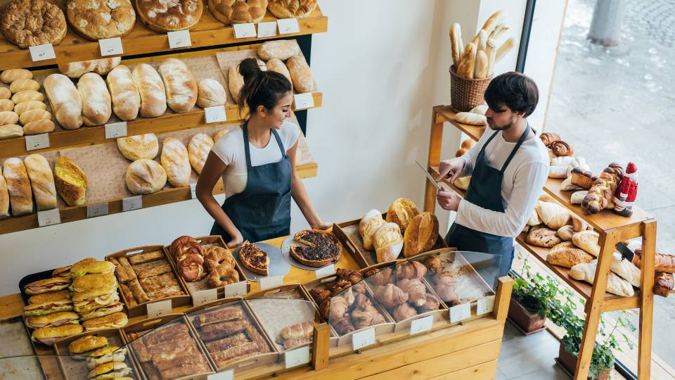 Insied a bakery with two workers